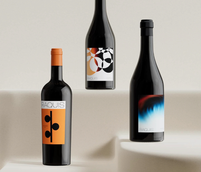 Three Raquis bottles on a warm plaster ground